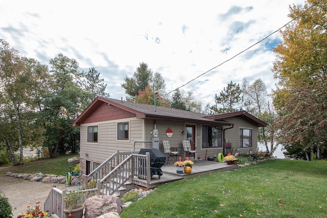 6823 Re Echo Ridge Dr NE, Remer, MN 56672 - back of property with a lawn and a deck