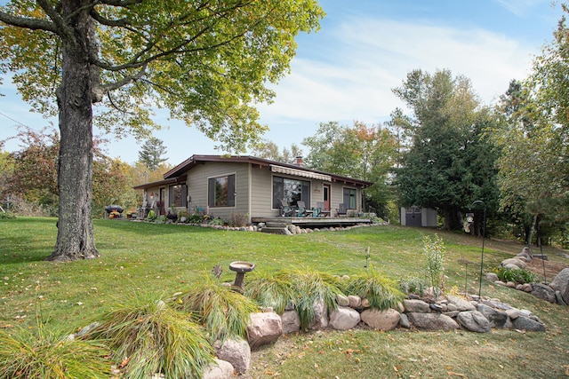 6823 Re Echo Ridge Dr NE, Remer, MN 56672 - view of front of property with a front lawn, a chimney, and a deck