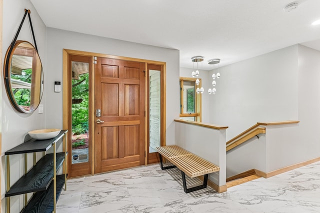 2665 Oriole Ave N, West Lakeland Twp, MN 55082 - foyer entrance with marble finish floors, a chandelier, and baseboards