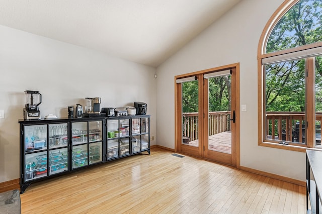 2665 Oriole Ave N, West Lakeland Twp, MN 55082 - empty room with hardwood / wood-style floors, baseboards, and high vaulted ceiling