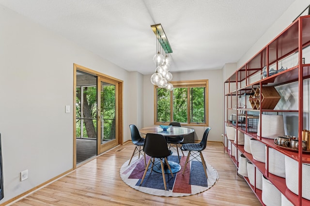 2665 Oriole Ave N, West Lakeland Twp, MN 55082 - dining space with healthy amount of natural light, light wood-style flooring, and baseboards