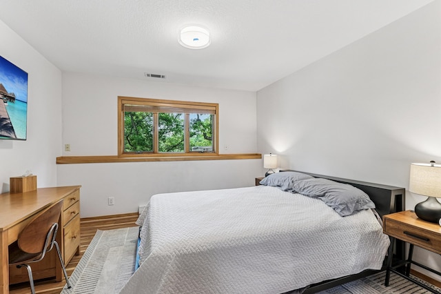 2665 Oriole Ave N, West Lakeland Twp, MN 55082 - bedroom featuring wood finished floors