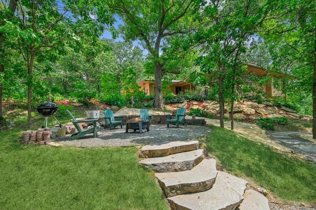 2665 Oriole Ave N, West Lakeland Twp, MN 55082 - view of grassy yard featuring an outdoor fire pit