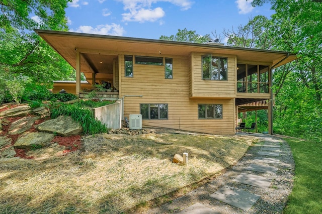2665 Oriole Ave N, West Lakeland Twp, MN 55082 - back of house with a sunroom and a patio area