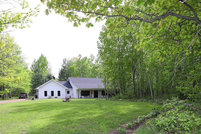 5004 W Rd, Silver Twp, MN 55767 - view of front of house with a front yard and driveway