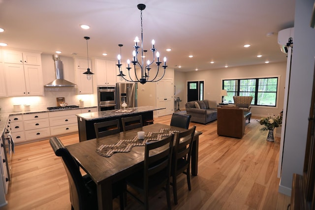 5004 W Rd, Silver Twp, MN 55767 - dining room with light wood-style flooring, recessed lighting, a chandelier, and a wall mounted AC