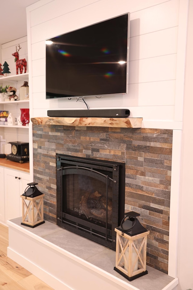 5004 W Rd, Silver Twp, MN 55767 - detailed view of wood finished floors and a fireplace with raised hearth