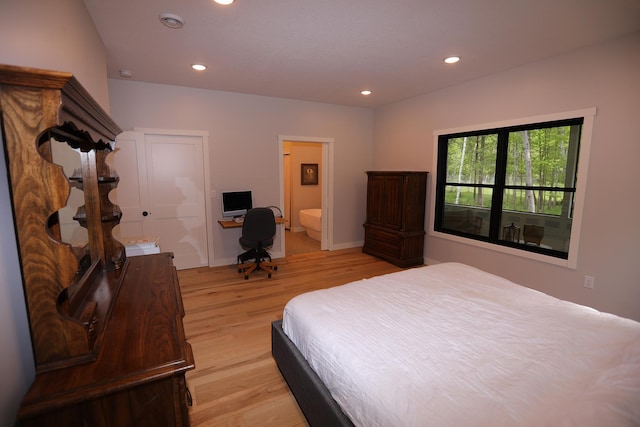 5004 W Rd, Silver Twp, MN 55767 - bedroom featuring light wood-style flooring, recessed lighting, and connected bathroom
