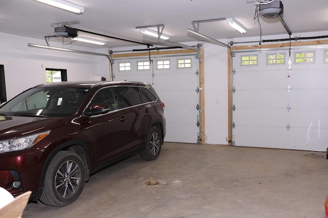 5004 W Rd, Silver Twp, MN 55767 - garage featuring a garage door opener