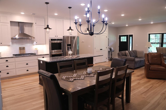 5004 W Rd, Silver Twp, MN 55767 - dining space featuring light wood-style flooring, recessed lighting, and a chandelier