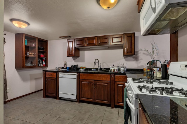 2007 8th St N, Saint Cloud, MN 56303 - kitchen featuring white appliances, ventilation hood, light tile patterned floors, open shelves, and dark stone counters