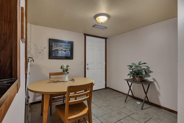 2007 8th St N, Saint Cloud, MN 56303 - dining space with a textured ceiling and light tile patterned floors
