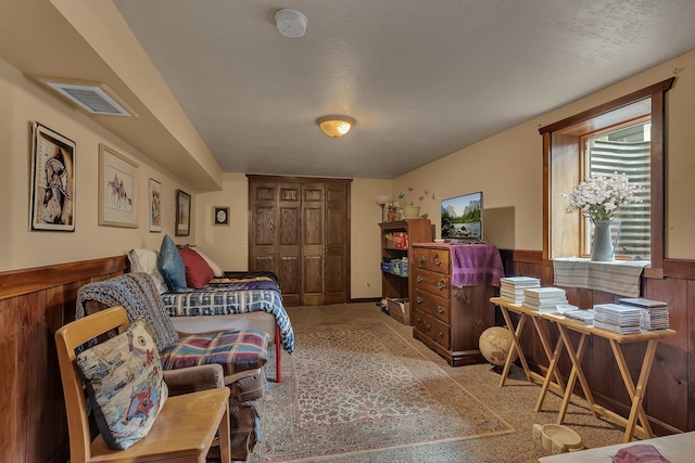 2007 8th St N, Saint Cloud, MN 56303 - bedroom featuring wainscoting and a closet
