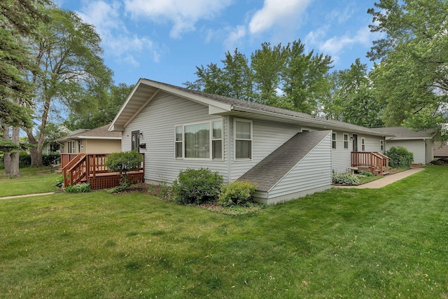 2007 8th St N, Saint Cloud, MN 56303 - view of home's exterior featuring a lawn and a deck