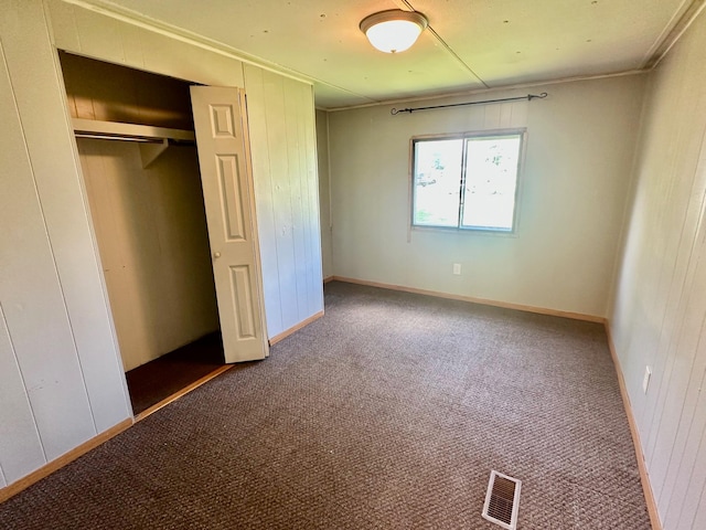 15373 Shawn St, Rocksbury Twp, MN 56701 - unfurnished bedroom with carpet, a closet, and ornamental molding
