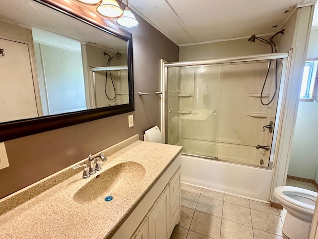 15373 Shawn St, Rocksbury Twp, MN 56701 - bathroom with toilet, vanity, tile patterned floors, and enclosed tub / shower combo