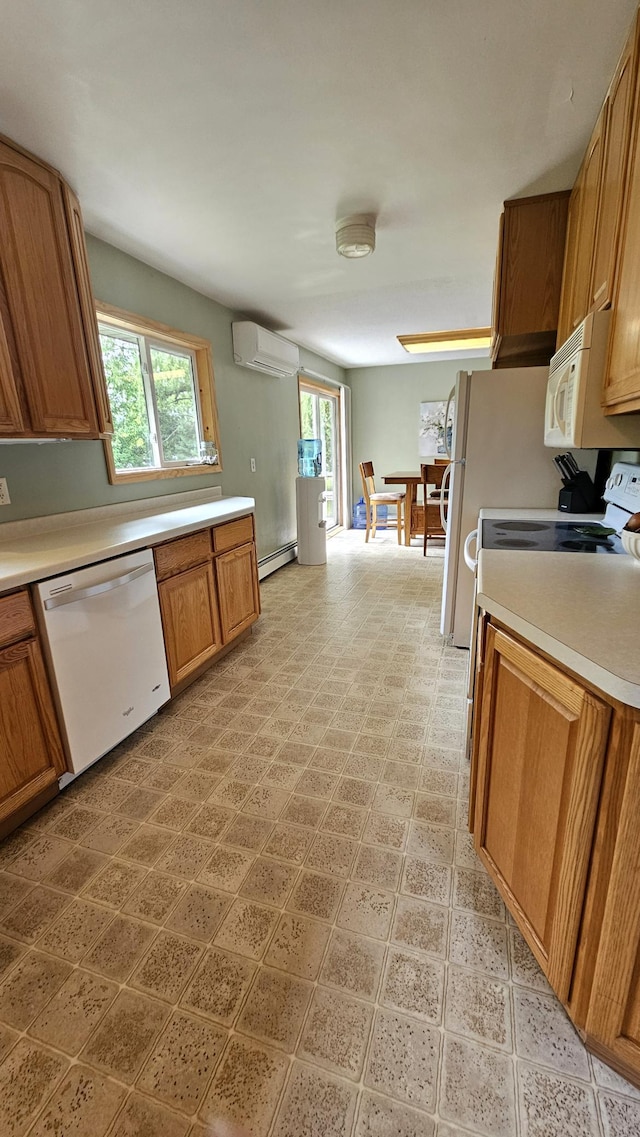 1309 Elm Ave N, Wheaton, MN 56296 - kitchen with white appliances, a wall mounted AC, a baseboard radiator, light countertops, and brown cabinets