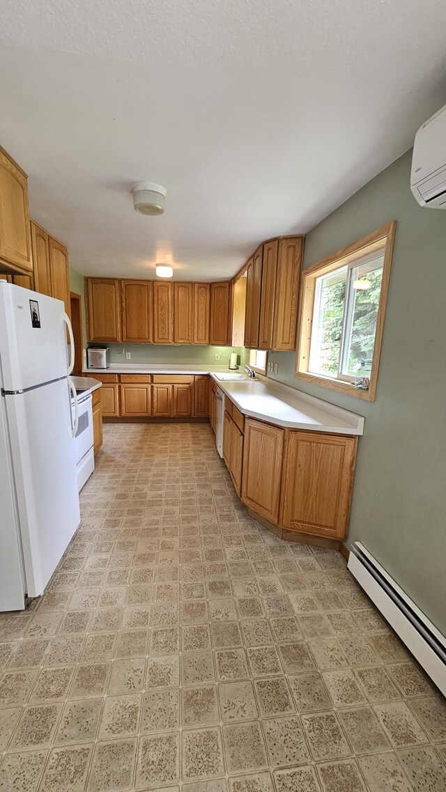 1309 Elm Ave N, Wheaton, MN 56296 - kitchen featuring white appliances, a baseboard radiator, brown cabinets, light countertops, and a wall mounted air conditioner