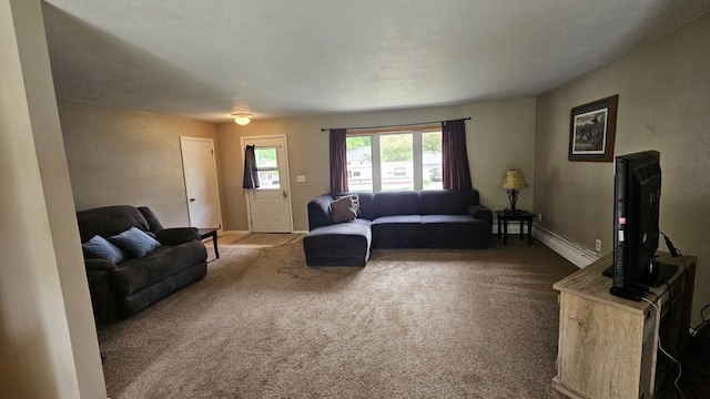 1309 Elm Ave N, Wheaton, MN 56296 - carpeted living area with a baseboard heating unit and baseboards
