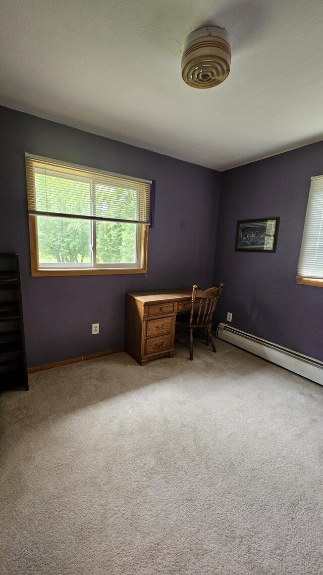 1309 Elm Ave N, Wheaton, MN 56296 - unfurnished office with carpet and a baseboard radiator