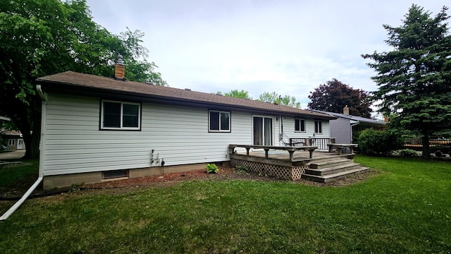 1309 Elm Ave N, Wheaton, MN 56296 - rear view of property featuring a deck, a lawn, and a chimney