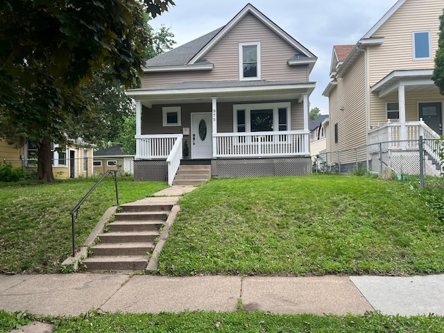 975 4th St E, Saint Paul, MN 55106 - view of front of house with stairs, covered porch, and a front lawn