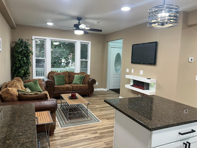 975 4th St E, Saint Paul, MN 55106 - living area featuring light wood-style flooring, ceiling fan, recessed lighting, and a glass covered fireplace