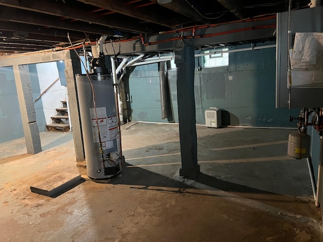 975 4th St E, Saint Paul, MN 55106 - basement featuring water heater and stairs