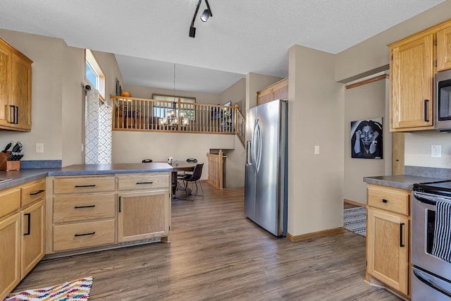 900 Isabella Ave, Clearwater, MN 55320 - kitchen with appliances with stainless steel finishes, wood finished floors, dark countertops, a chandelier, and a textured ceiling