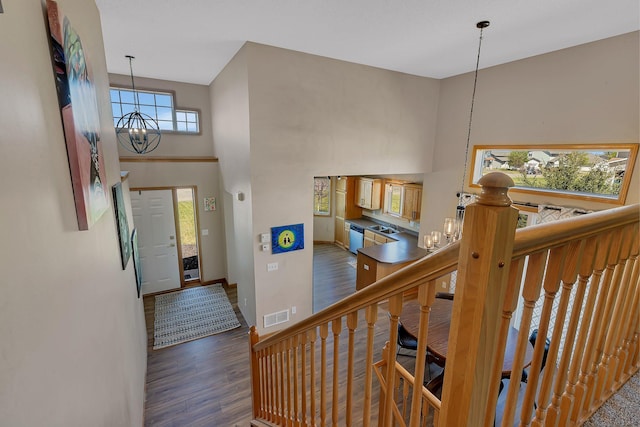900 Isabella Ave, Clearwater, MN 55320 - entrance foyer featuring a chandelier, wood finished floors, a towering ceiling, and baseboards