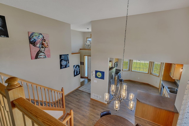900 Isabella Ave, Clearwater, MN 55320 - stairs with a chandelier, baseboards, and wood finished floors