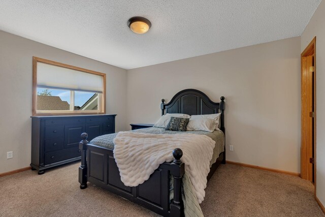 900 Isabella Ave, Clearwater, MN 55320 - bedroom featuring light carpet, a textured ceiling, and baseboards