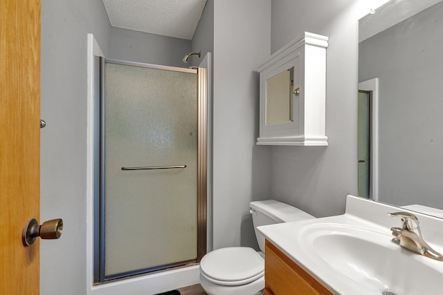 900 Isabella Ave, Clearwater, MN 55320 - bathroom featuring a stall shower, vanity, toilet, and a textured ceiling