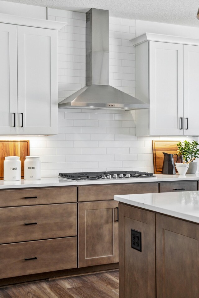 14580 106th Pl N, Maple Grove, MN 55369 - kitchen with wall chimney range hood, light countertops, white cabinets, decorative backsplash, and dark wood finished floors