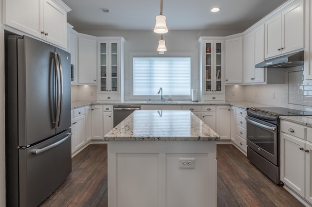 2105 7th Ave S, Saint Cloud, MN 56301 - kitchen with stainless steel appliances, under cabinet range hood, a sink, dark wood-style floors, and white cabinetry