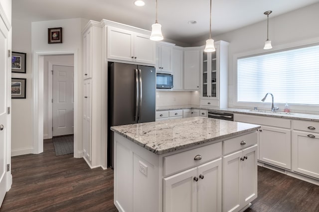 2105 7th Ave S, Saint Cloud, MN 56301 - kitchen with a sink, black microwave, dark wood-type flooring, white cabinets, and recessed lighting