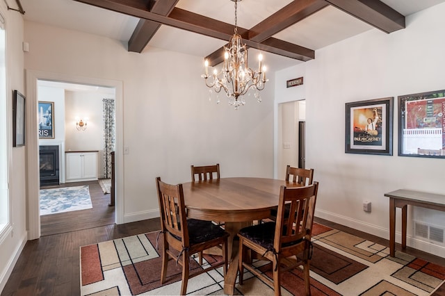 2105 7th Ave S, Saint Cloud, MN 56301 - dining space featuring dark wood-type flooring, baseboards, beamed ceiling, a chandelier, and a glass covered fireplace