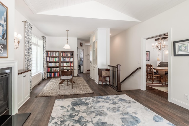 2105 7th Ave S, Saint Cloud, MN 56301 - interior space with dark wood finished floors, lofted ceiling, and a chandelier