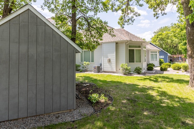 2105 7th Ave S, Saint Cloud, MN 56301 - view of property exterior with a yard and a shingled roof