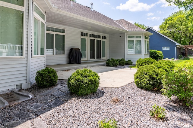 2105 7th Ave S, Saint Cloud, MN 56301 - back of house featuring roof with shingles and a patio