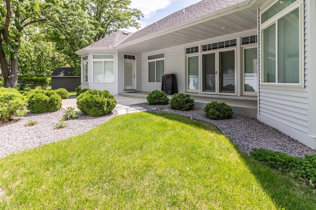 2105 7th Ave S, Saint Cloud, MN 56301 - back of house featuring roof with shingles and a lawn