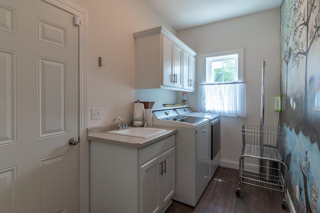 2105 7th Ave S, Saint Cloud, MN 56301 - washroom with washer and clothes dryer, cabinet space, dark wood-style floors, and baseboards