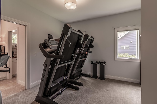 2105 7th Ave S, Saint Cloud, MN 56301 - workout area with healthy amount of natural light, light carpet, and baseboards