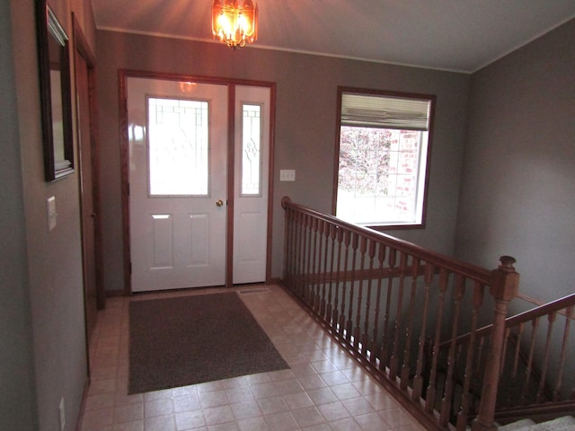 180 Bordson St, Appleton, MN 56208 - entrance foyer featuring a chandelier, stairs, and ornamental molding