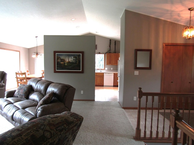180 Bordson St, Appleton, MN 56208 - living room with a chandelier, light colored carpet, lofted ceiling, and baseboards