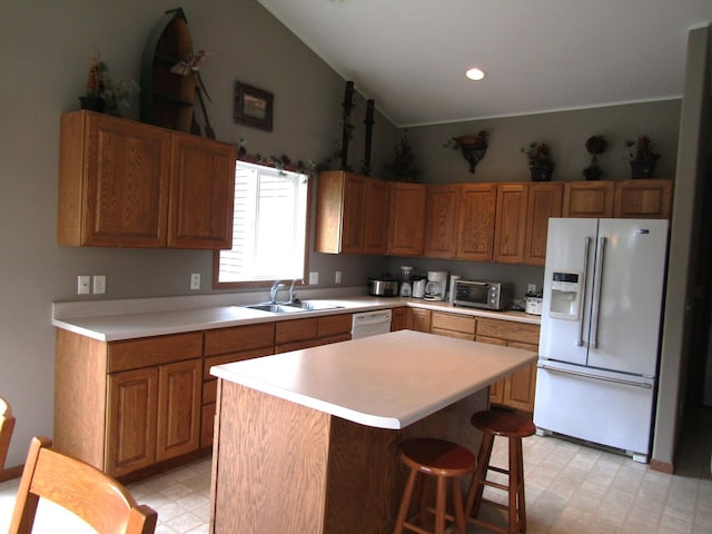 180 Bordson St, Appleton, MN 56208 - kitchen with white appliances, a sink, lofted ceiling, light floors, and light countertops