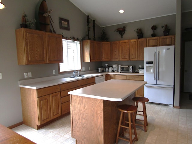 180 Bordson St, Appleton, MN 56208 - kitchen featuring white appliances, a sink, light floors, light countertops, and high vaulted ceiling