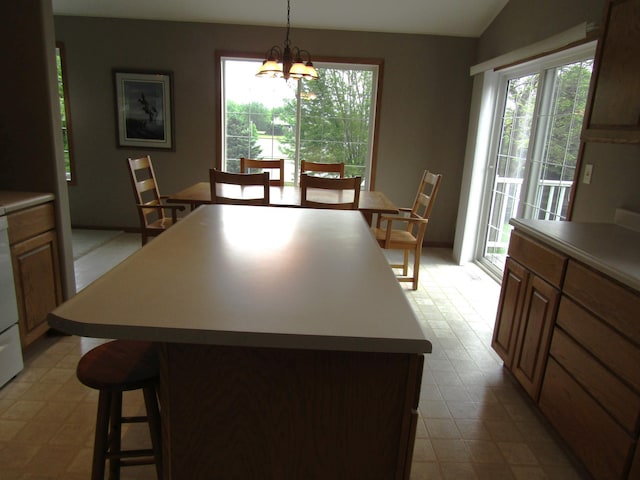 180 Bordson St, Appleton, MN 56208 - dining space featuring light flooring, a chandelier, healthy amount of natural light, and lofted ceiling