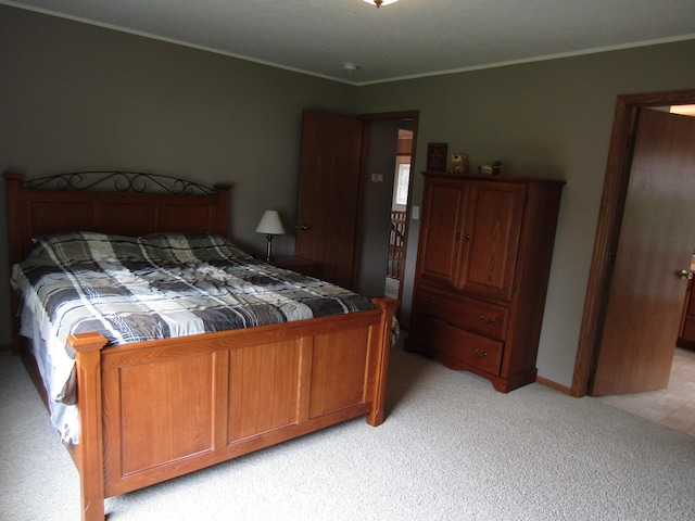 180 Bordson St, Appleton, MN 56208 - bedroom with light colored carpet, ornamental molding, and baseboards