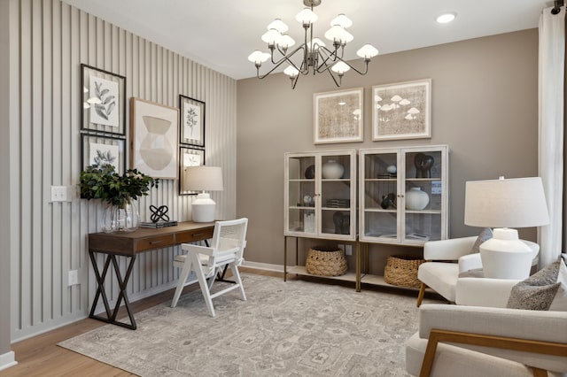 14625 105th Pl N, Maple Grove, MN 55369 - office area with wood finished floors, a chandelier, and baseboards
